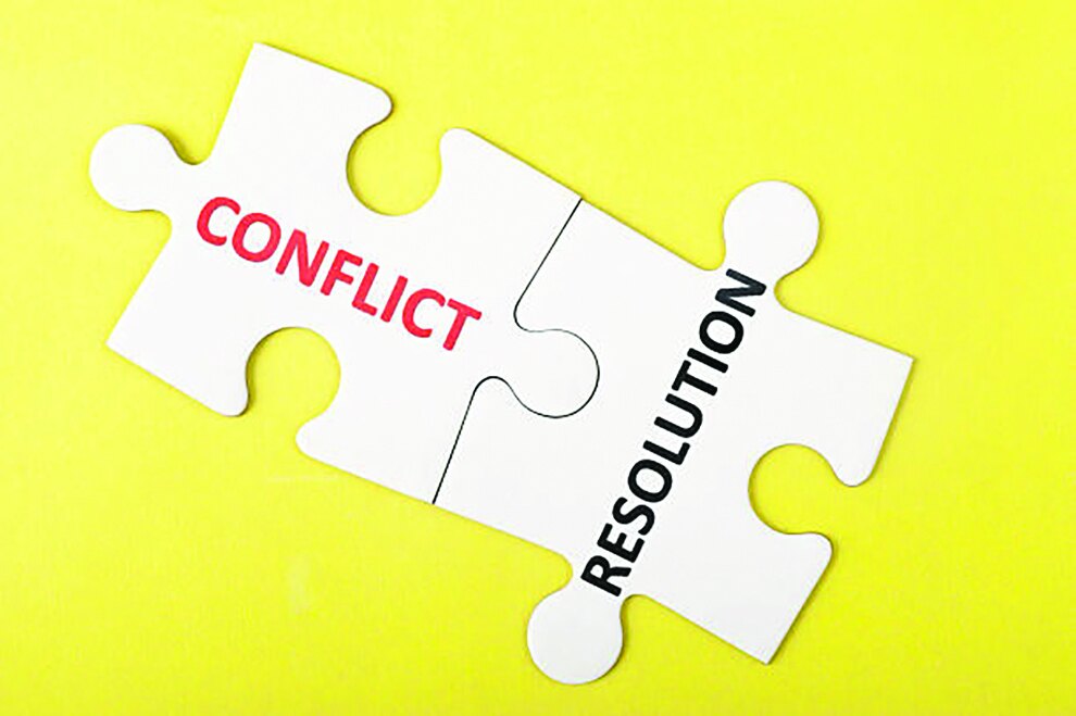 Two puzzle pieces labeled Conflict and Resolution fitting together