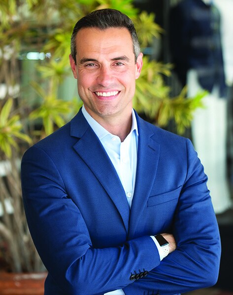 Boca Raton Mayor Andy Thomson in a navy jacket, arms crossed