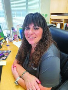 April Narine, Boca Pointe general manager, seated at her desk
