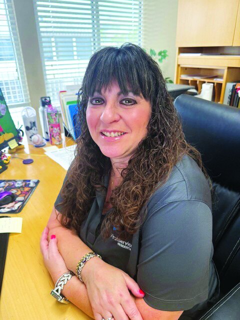 April Narine, Boca Pointe general manager, seated at her desk