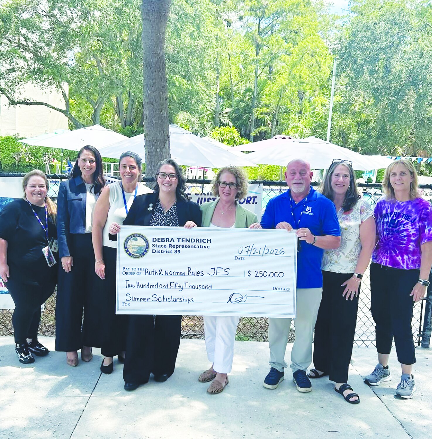 State Representative Debra Tendrich presenting a $250,000 check to Rales JFS staff
