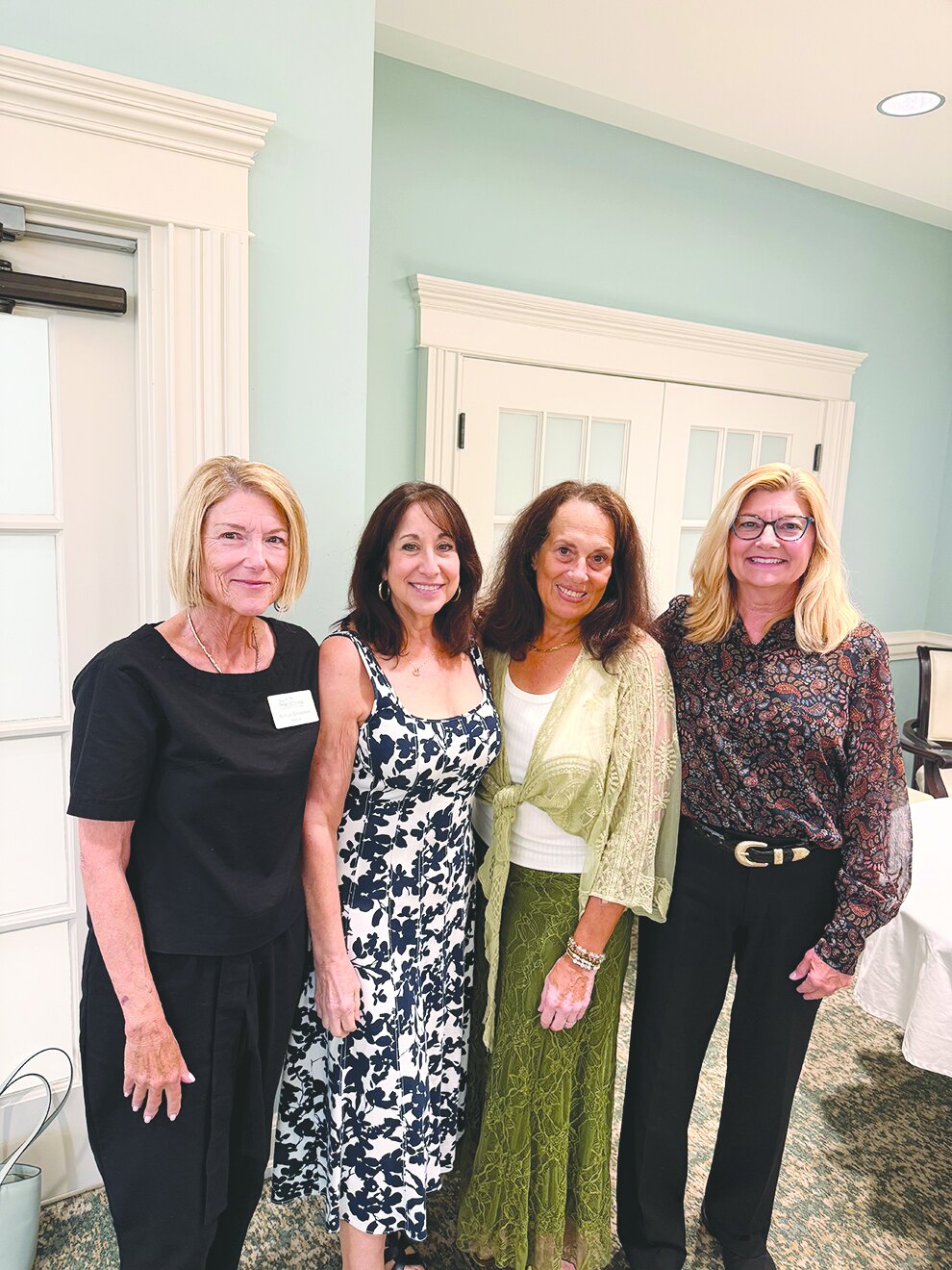 Four Boca Pointe Pap Corps officers and board members standing together