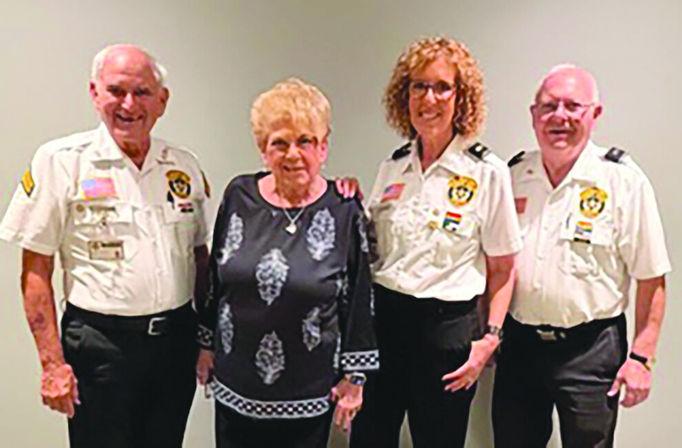 Four Palm Beach Sheriff volunteer lieutenants and the event chair standing together