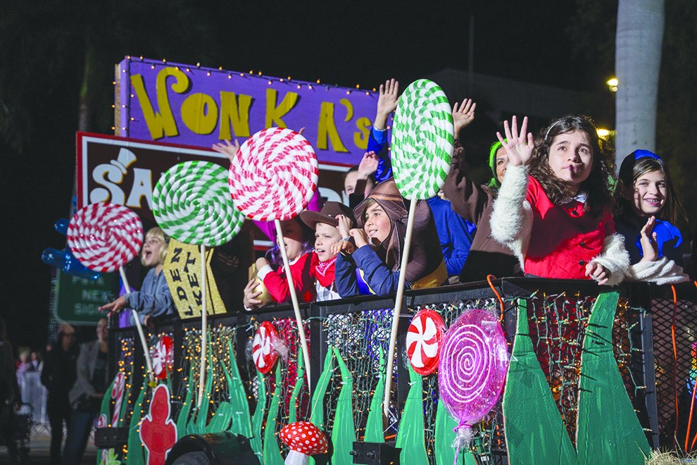 Children on a candy-themed float in the Boca Raton holiday parade