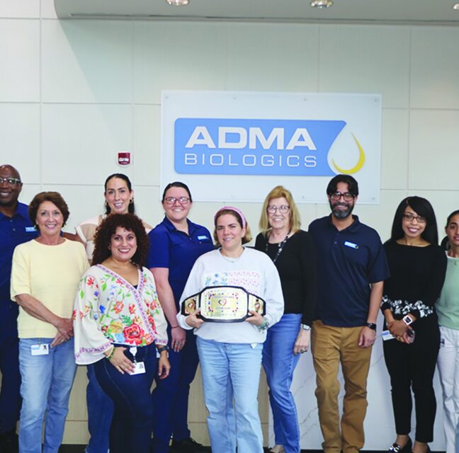 ADMA Biologics team with the Corporate Challenge championship belt