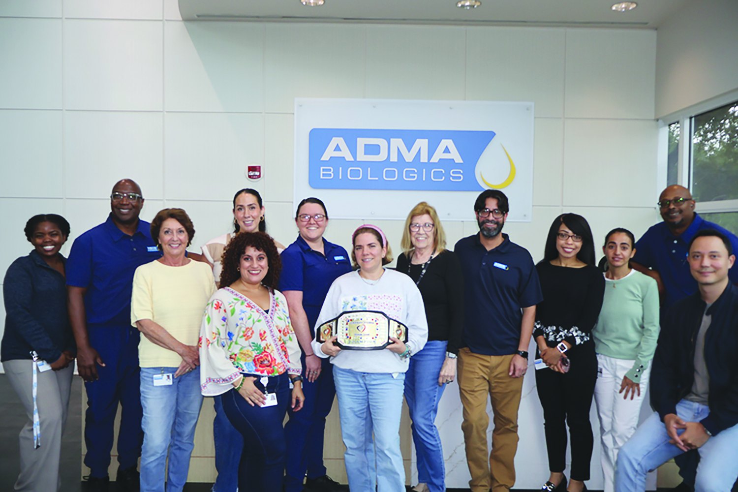 ADMA Biologics team with the Corporate Challenge championship belt