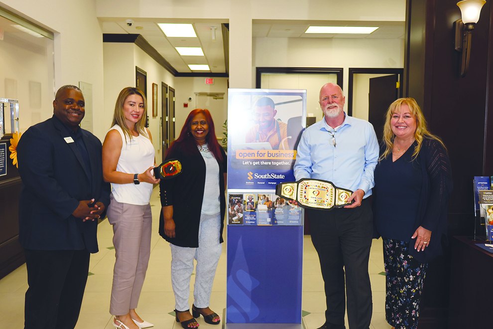 SouthState Bank team holding Corporate Challenge championship belts