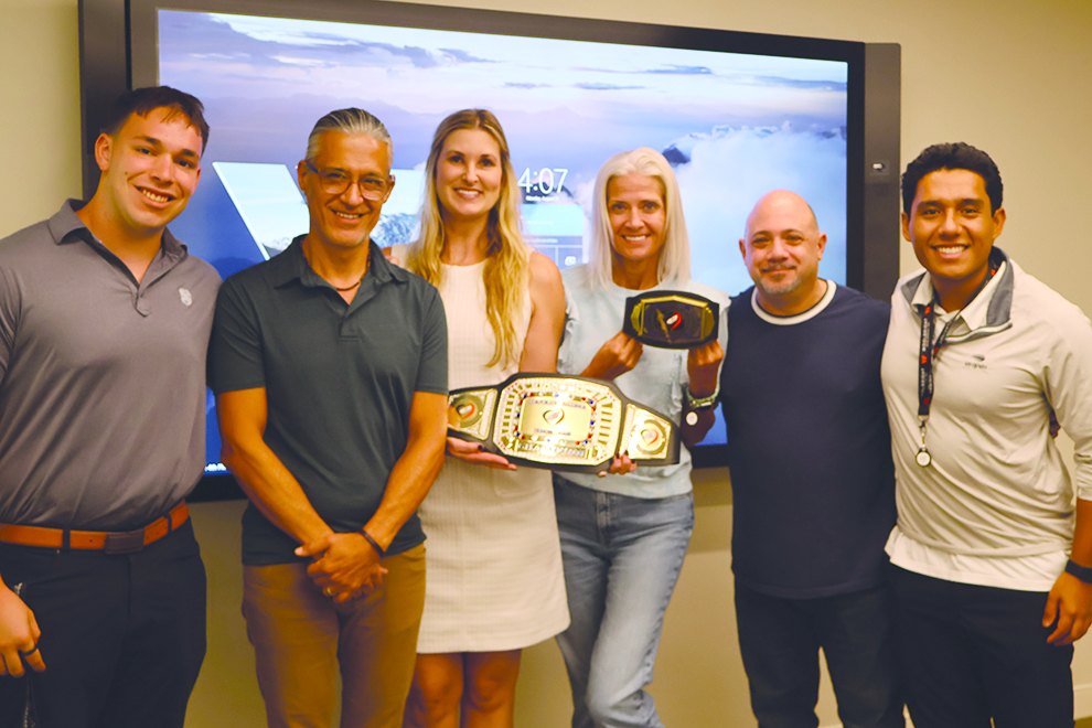 Woolbright Development team with the Corporate Challenge championship belt